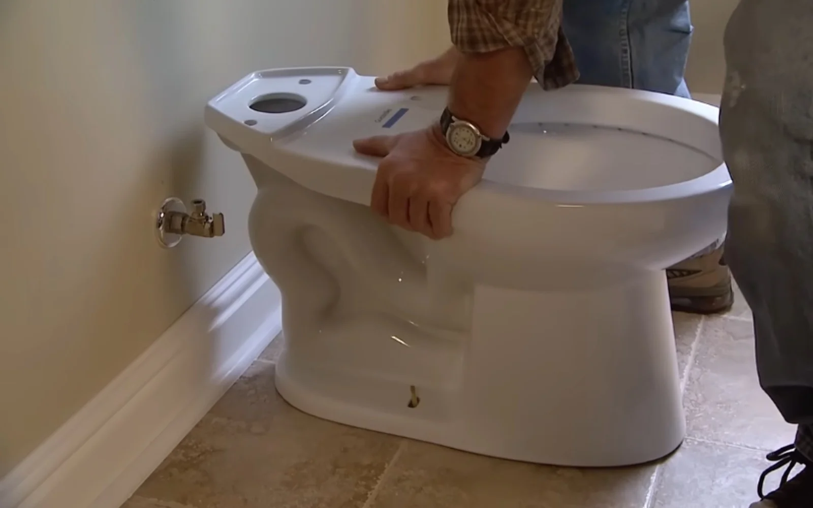 Plumber repairing a residential toilet in Clearwater, FL